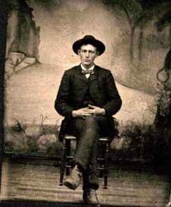 man sitting tintype